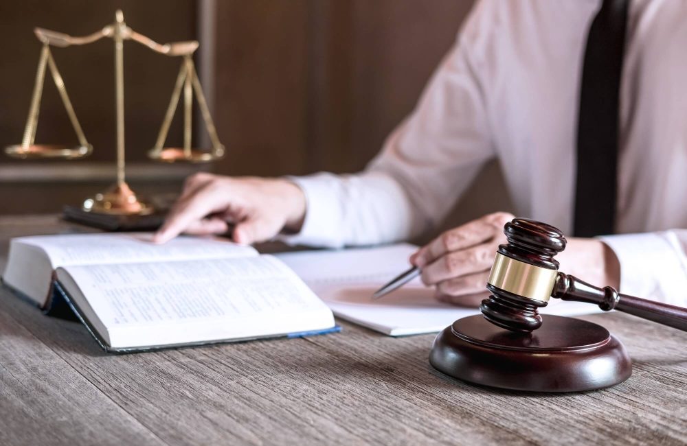 male-lawyer-or-judge-working-with-law-books-1.jpg male-lawyer-or-judge-working-with-law-books-1.jpg